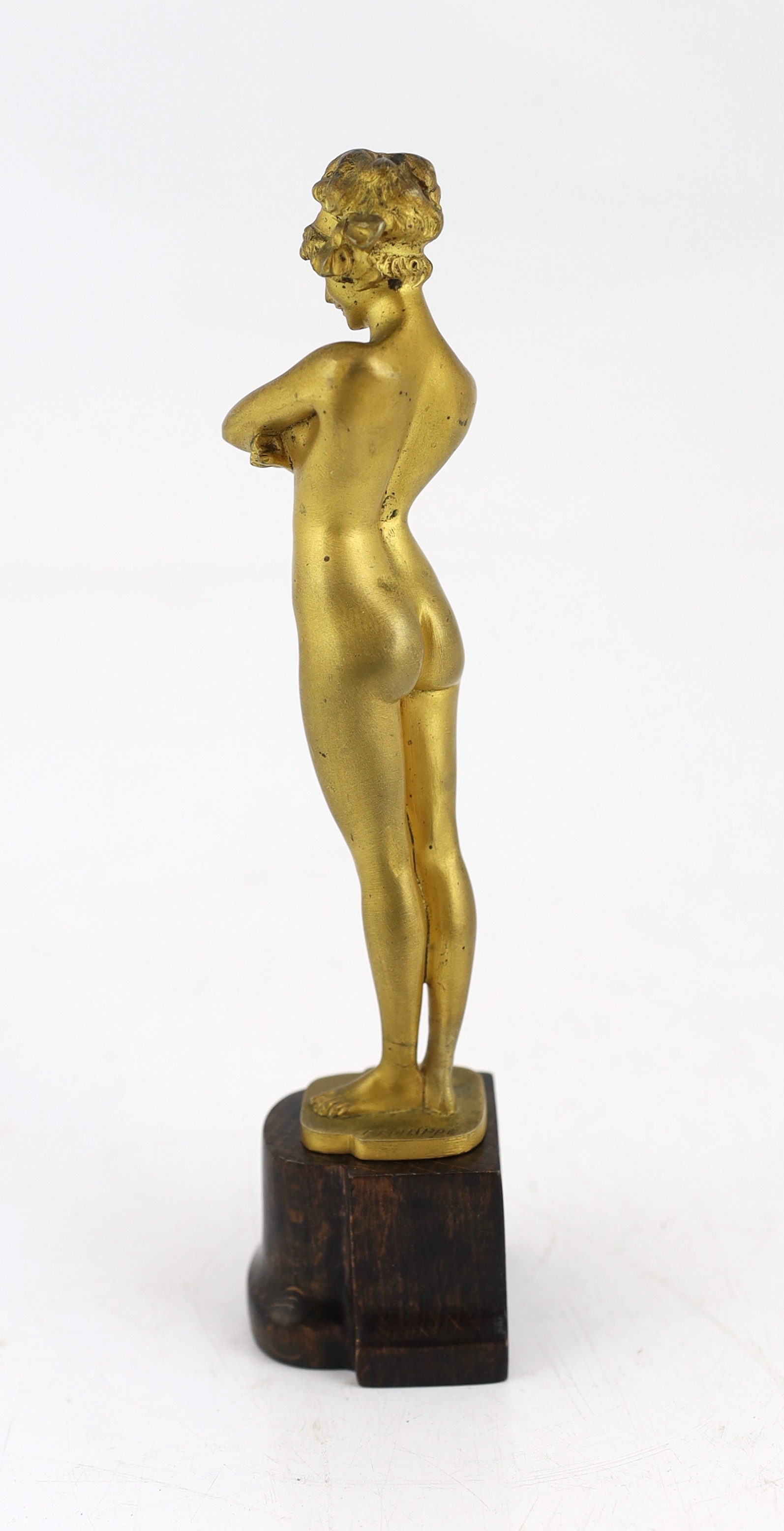 Paul Philippe (French, 1870-1930), a gilt bronze figure of a standing nude woman, 'The Challenge', 21.5cm high